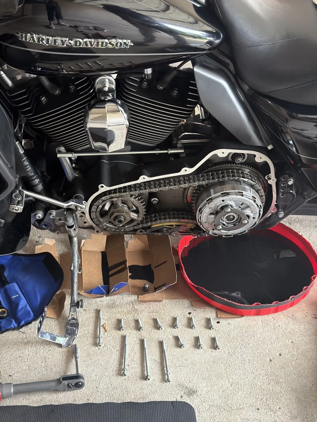 A Harley-Davidson primary drive opened for an on-site clutch repair by Affordable Mobile Mechanic